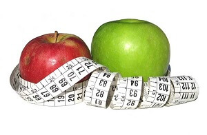 Red & Green apples with tape measure