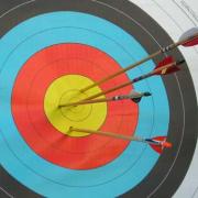 hitting your target - arrows hitting the bullseye 