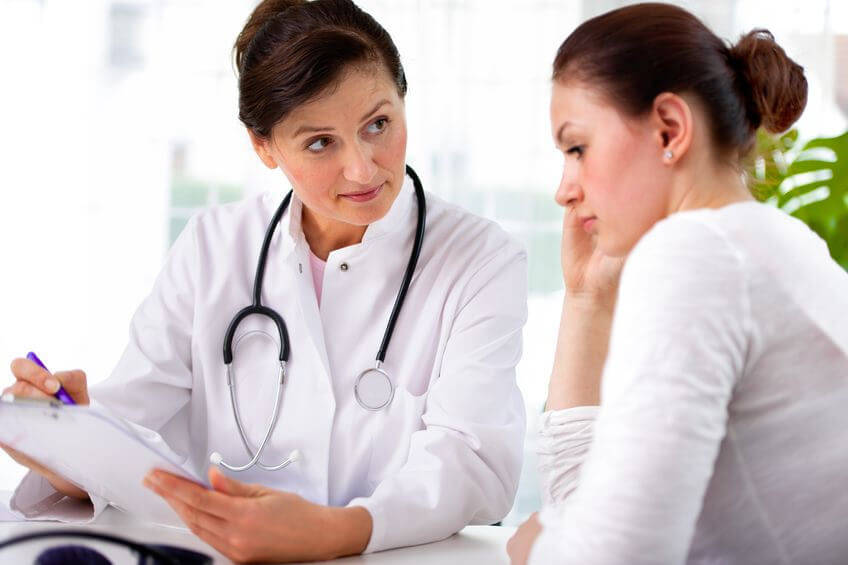 Doctor and Lady Discussing Health