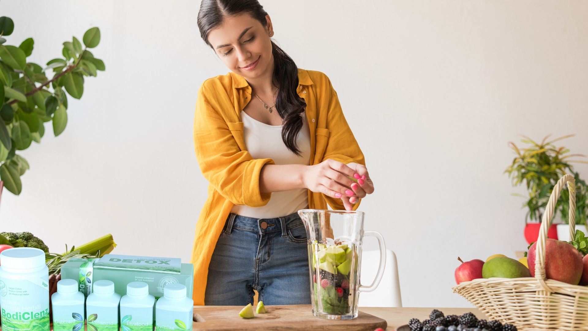 Woman Adding Vegetables in a Blender